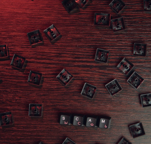 computer keys spelling out scam